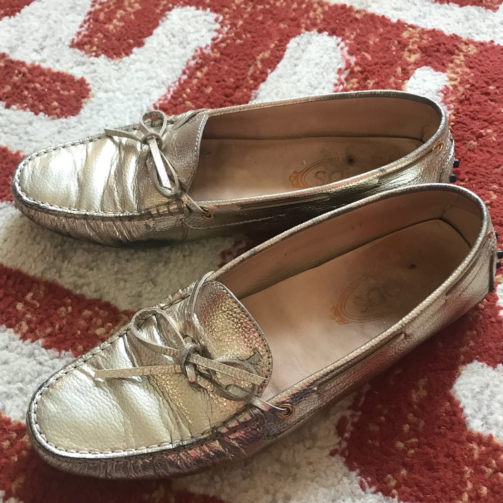 TOD’S gold leather loafers